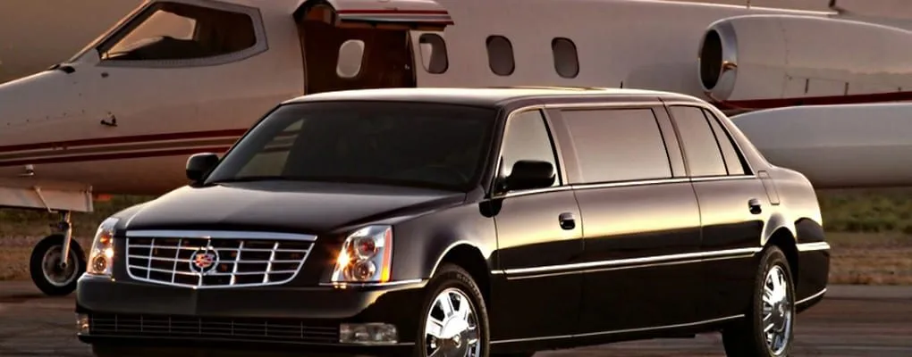 Executive sedan beside a private jet — corporate FBO service in Austin