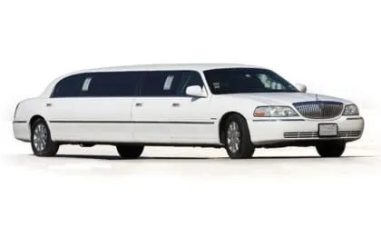 White five-door stretch limousine in Austin at night